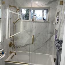 Gold-Hinges-and-Fixtures-for-Custom-Glass-Door-Installation-in-Bathroom-Remodel-in-Wood-Ridge-NJ 1